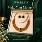 Madhushrea Collection green stone gold-tone necklace set in an ivory box against an emerald background