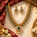 Antique gold long temple necklace set with green stones and matching pearl drop earrings