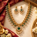 Antique gold long temple necklace set with green stones and matching pearl drop earrings