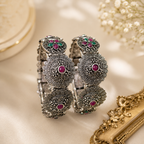 Oxidised peacock floral ruby green stone folding kada - front view