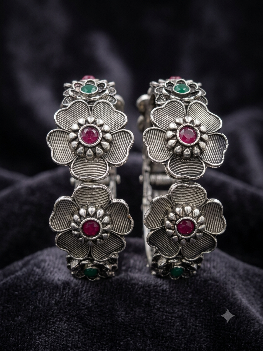 Oxidised silver floral ruby stone folding kada worn on wrist