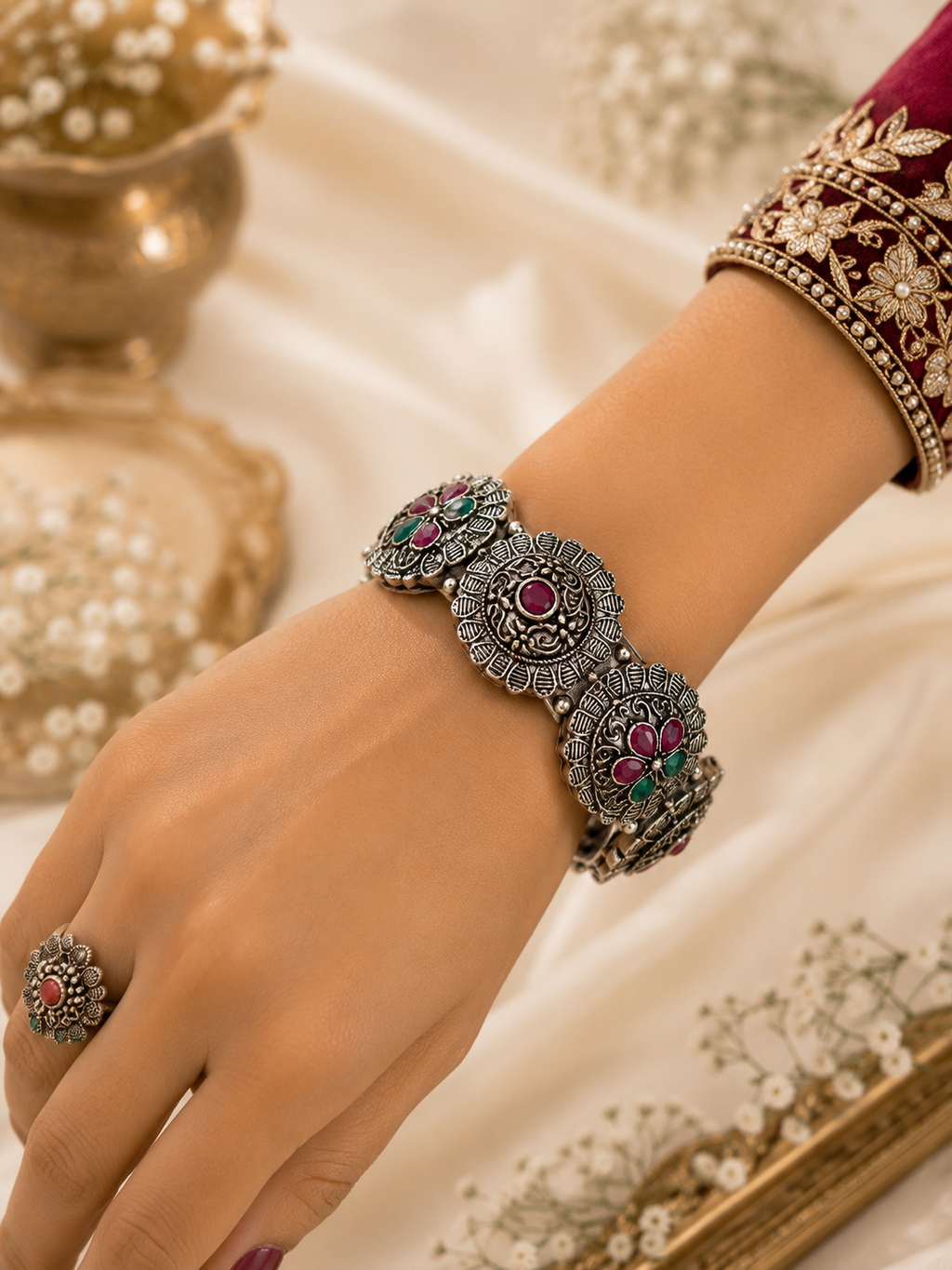 Oxidised peacock floral ruby green stone folding kada worn on wrist